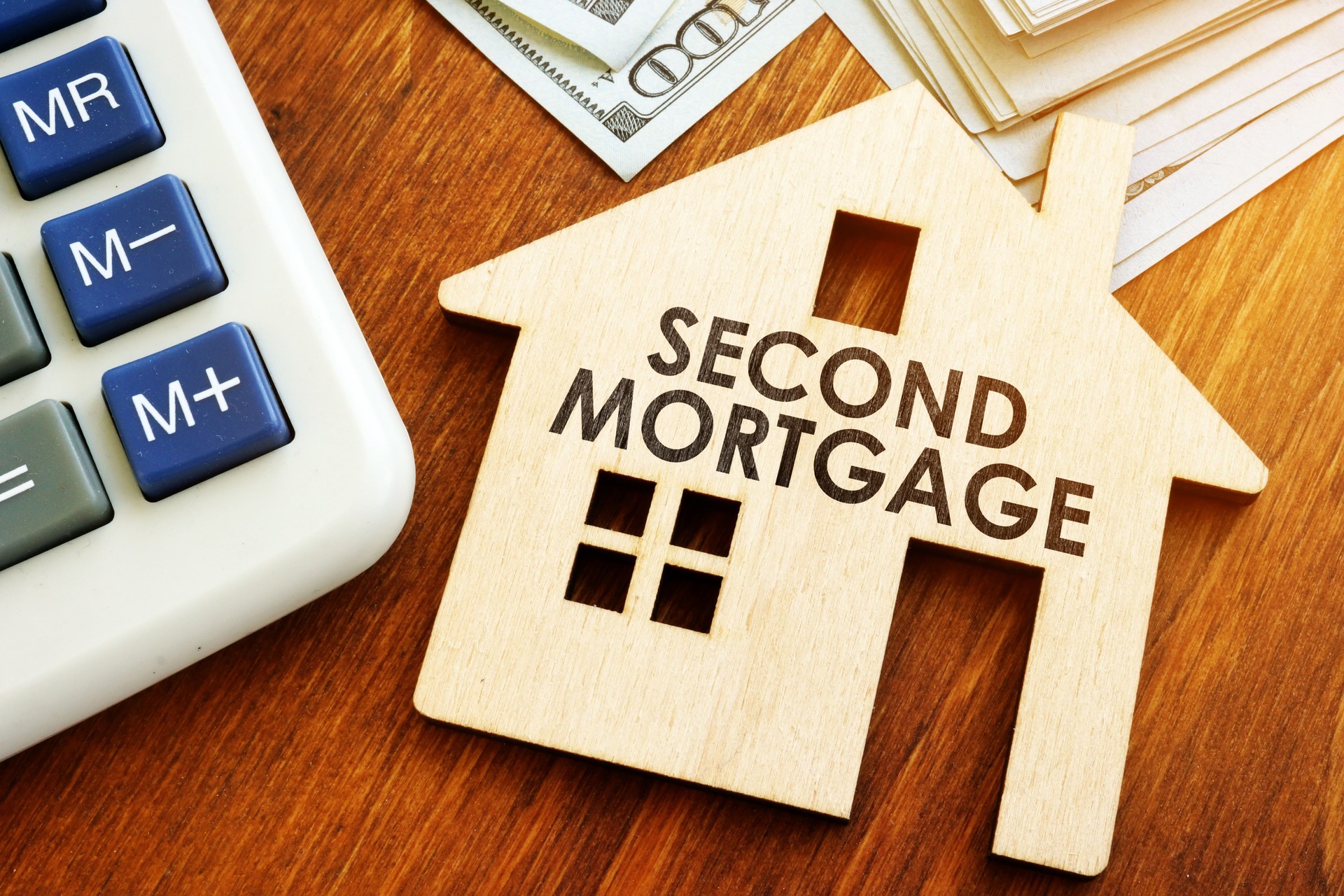 Second Mortgage written on wooden home.