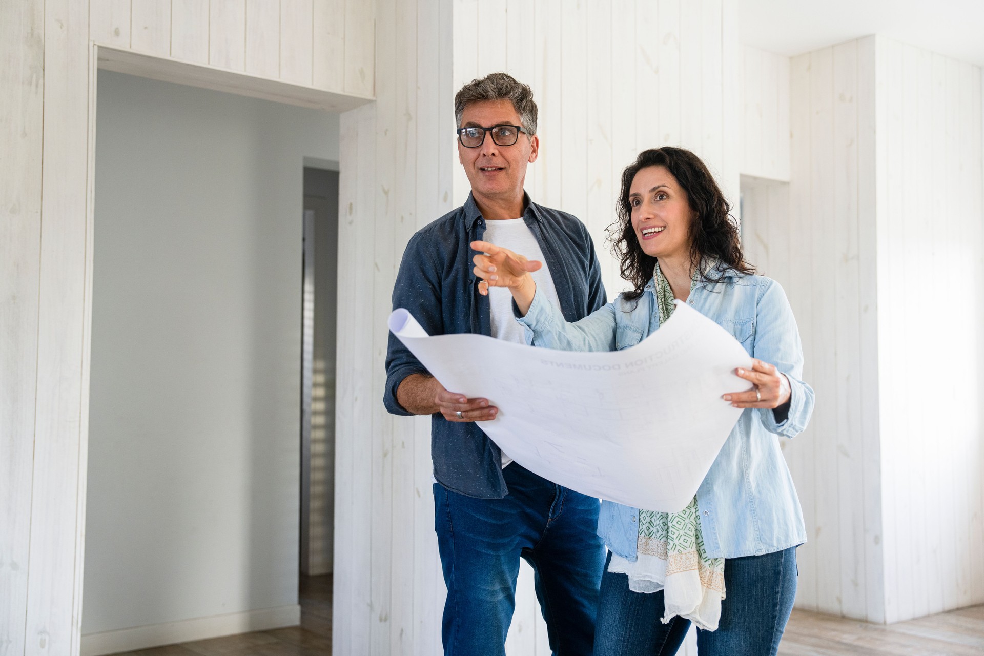 Couple assessing ideas for home renovations